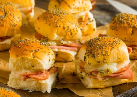 Sliders made with soft buns, sliced meat, and melted cheese in the Southeastern Michigan area