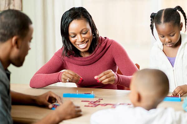 A family playing indoor games & spending quality time in Ann Arbor, MI