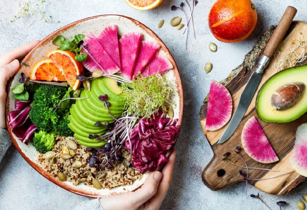 Seasonal salad ingredients with fresh fruits, vegetables, and greens