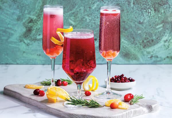 Colorful fruity drinks with berries and mint served on a bright tray in Ann Arbor, MI